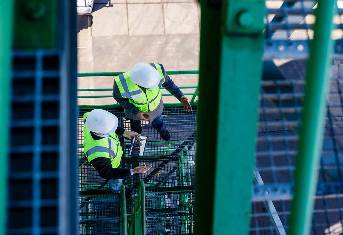 Two men with hardhats from birdview